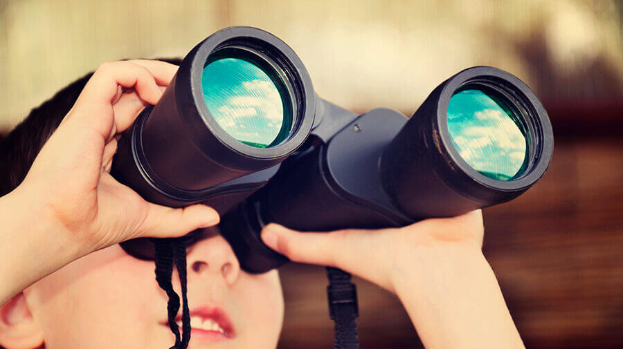 Kid using binoculars