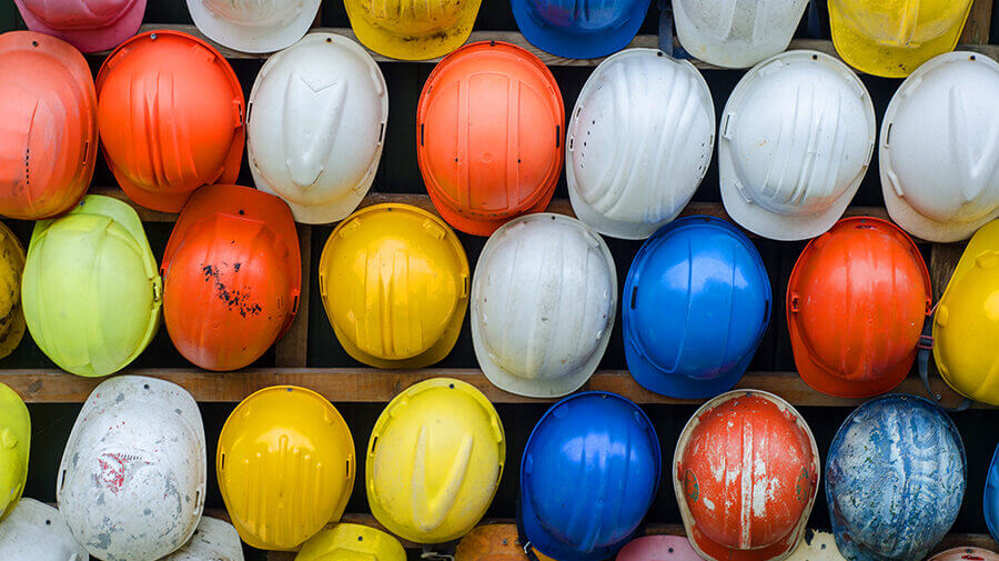 Wall of Hard Hats to Reduce Risk and Increase Freelance Website Conversions