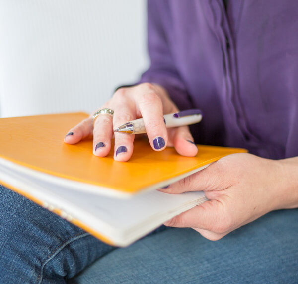 Woman With Notebook Attending A Small Business Branding, Website, And Marketing Workshop