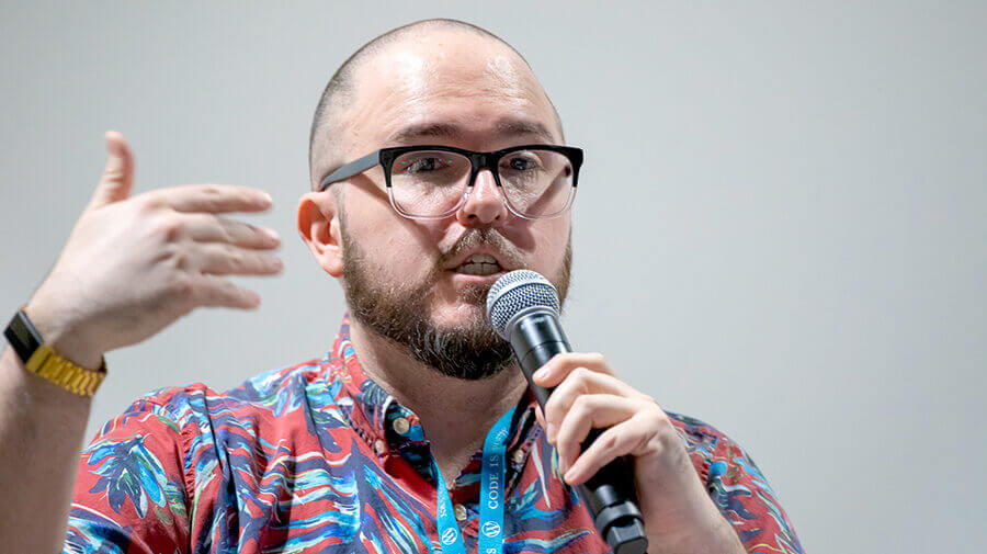 Victor Ramirez Holding A Microphone