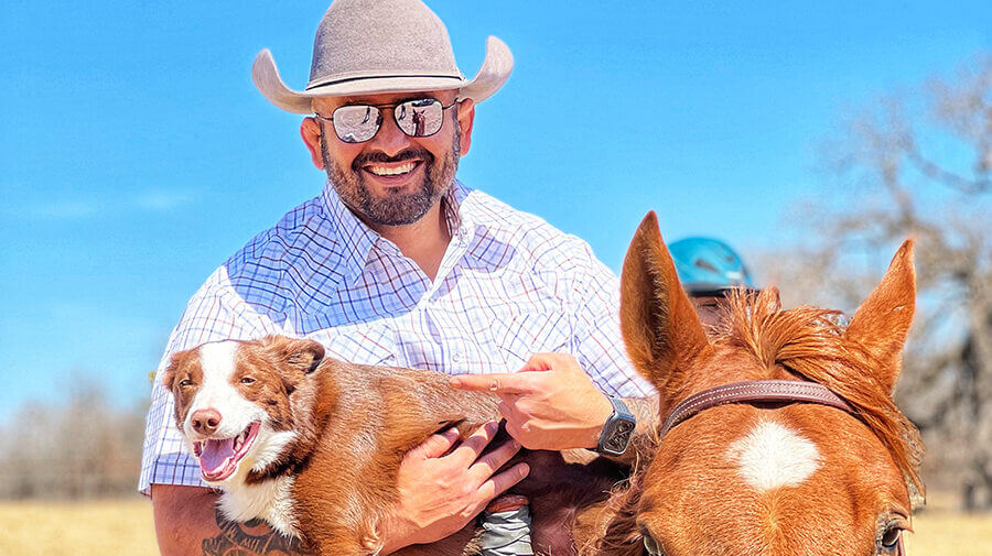 Tony Perez Holding His Dog On A Horse