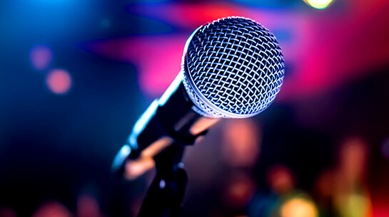 Microphone on stage ready for someone to deliver their signature talk