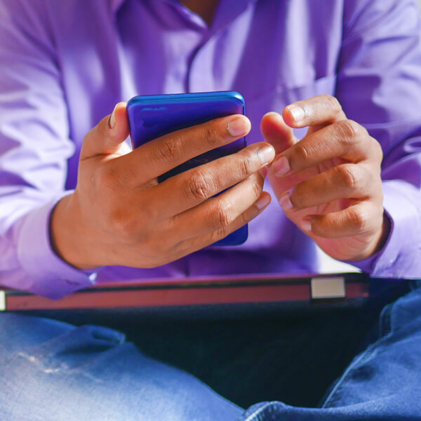 A man using a smartphone to move through a content marketing sales funnel