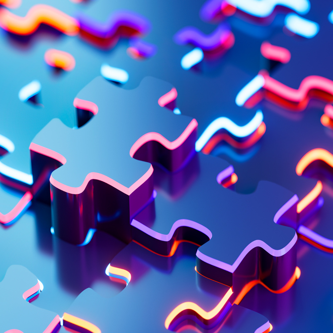 Navy blue puzzle pieces with neon, multi-color edges representing the pieces of a brand that need to be documented fitting together